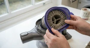 Alt text for a side-by-side comparison of a clean filter versus a heavily soiled, grey, dust-clogged vacuum filter needing replacement.