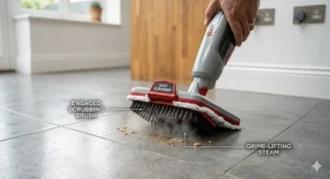 Alt text for image 6: The built-in flip-down easy scrubber brush on a Bissell PowerFresh mop tackling a stubborn mark on floor tiles.