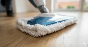 Close-up of a soft microfibre pad attachment designed to lift dirt from laminate surfaces without scratching the wear layer.