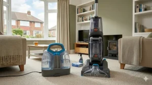 A side-by-side comparison of a compact spot cleaner and a full-size upright carpet washer on a light beige carpet in a British living room.
