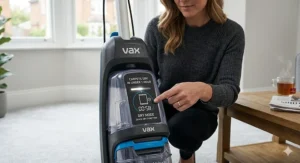 A close-up of the digital display on a Vax carpet cleaner showing the Dry Mode setting which ensures carpets are dry in under one hour.