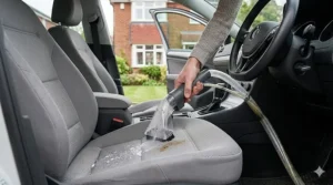 Deep cleaning car upholstery and floor mats with a Rug Doctor carpet cleaner.