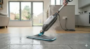 An electric steam mop sanitising large ceramic kitchen floor tiles and lifting dirt from grout lines using heated steam.