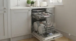 An energy-efficient slimline dishwasher displaying its high rating label to help lower household utility bills