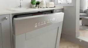 Digital control panel on a slimline dishwasher showing quick wash and eco settings