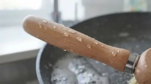 Ergonomic handle of a non-stick pan cleaning brush offering a comfortable grip for daily kitchen tasks.
