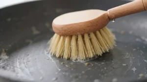 Close-up of soft, flexible bristles on a non-stick pan brush designed to prevent scratching.